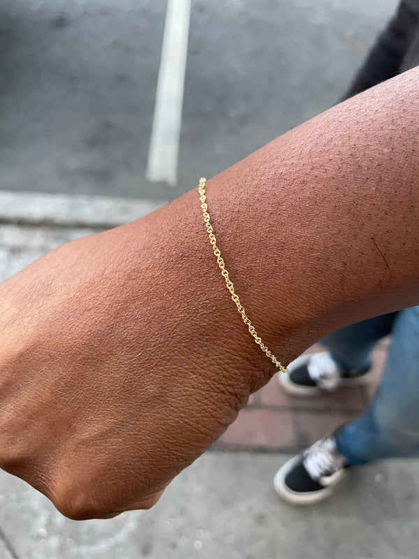 model shot of twisted sister 14K singapore style chain on wrist