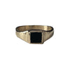 Gold ring with a black stone on a white background