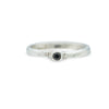 silver ring with barnacle detail holding black diamond on white background