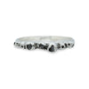 silver barnacle band with black diamonds on a white background
