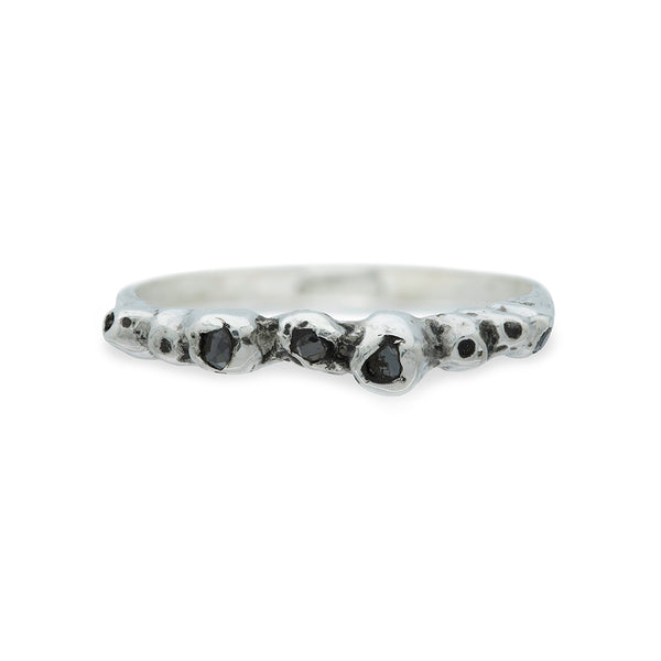 silver barnacle band with black diamonds on a white background
