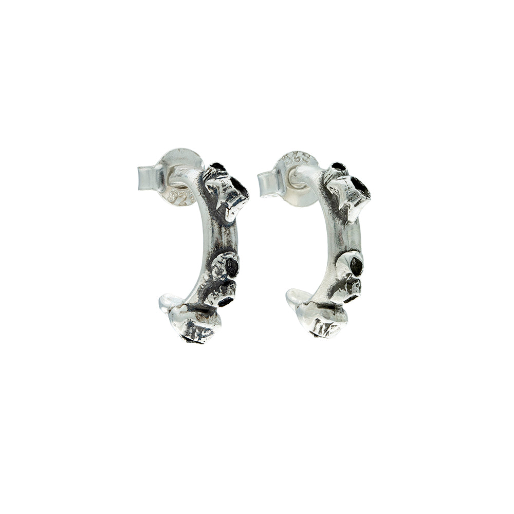Pair of barnacle encrused silver hoop earrings  on a white background