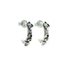 Pair of barnacle encrused silver hoop earrings  on a white background