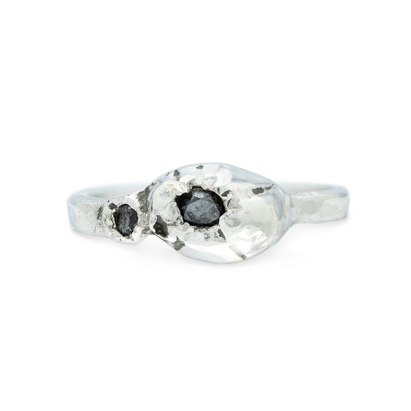 silver ring with big and small barnacle detail set with black diamonds on a silver band