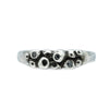 silver ring with barnacle details set with black diamonds on white background
