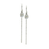 Pair of keishi pearls on silver earrings with chain drops on a white background