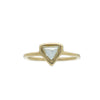 Gold ring with a triangular macle diamond on a white background