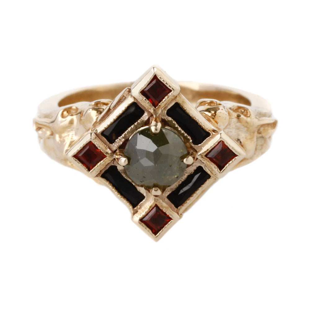 gold poisin ring with lions holding a jeweled center cluster that is a little box