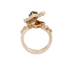 Gold ring showing an open top and secret compartment  on a white background