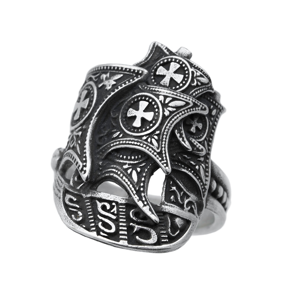 silver ship ring shot at an angle, oxidized, showing intricate detail