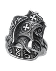 silver ship ring shot at an angle, oxidized, showing intricate detail