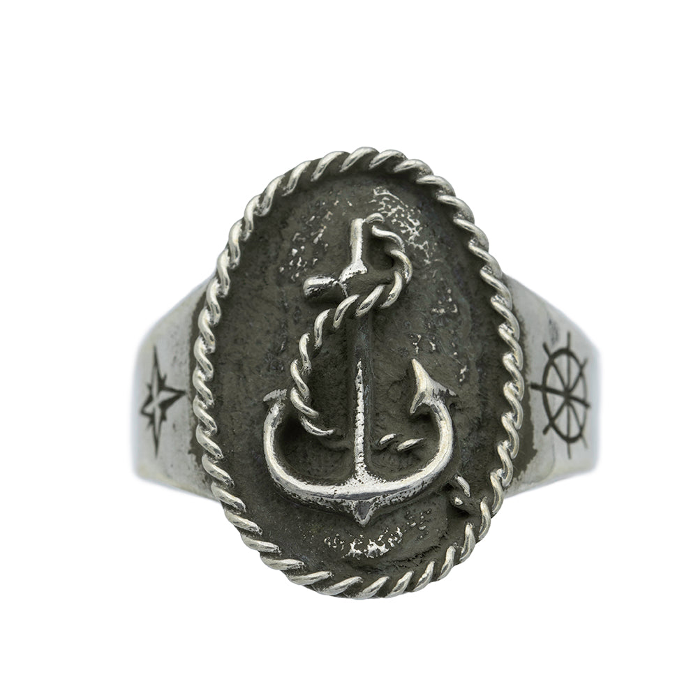 Silver ring with anchor design, nautical star and ships wheel engraving.