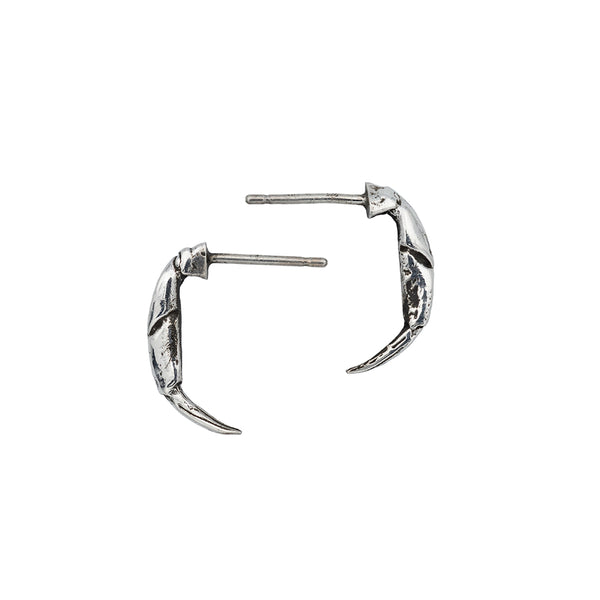 Little silver crab pincer earrings pointing left and right.