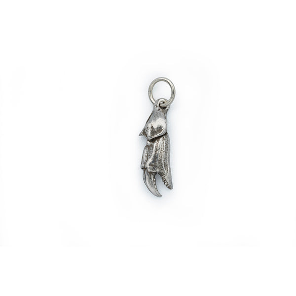 A silver crab claw with antique detail hanging from a silver jump ring.