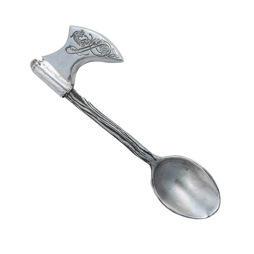 A silver baby spoon with a wooden ax handle with engraved Norse dragon detail.