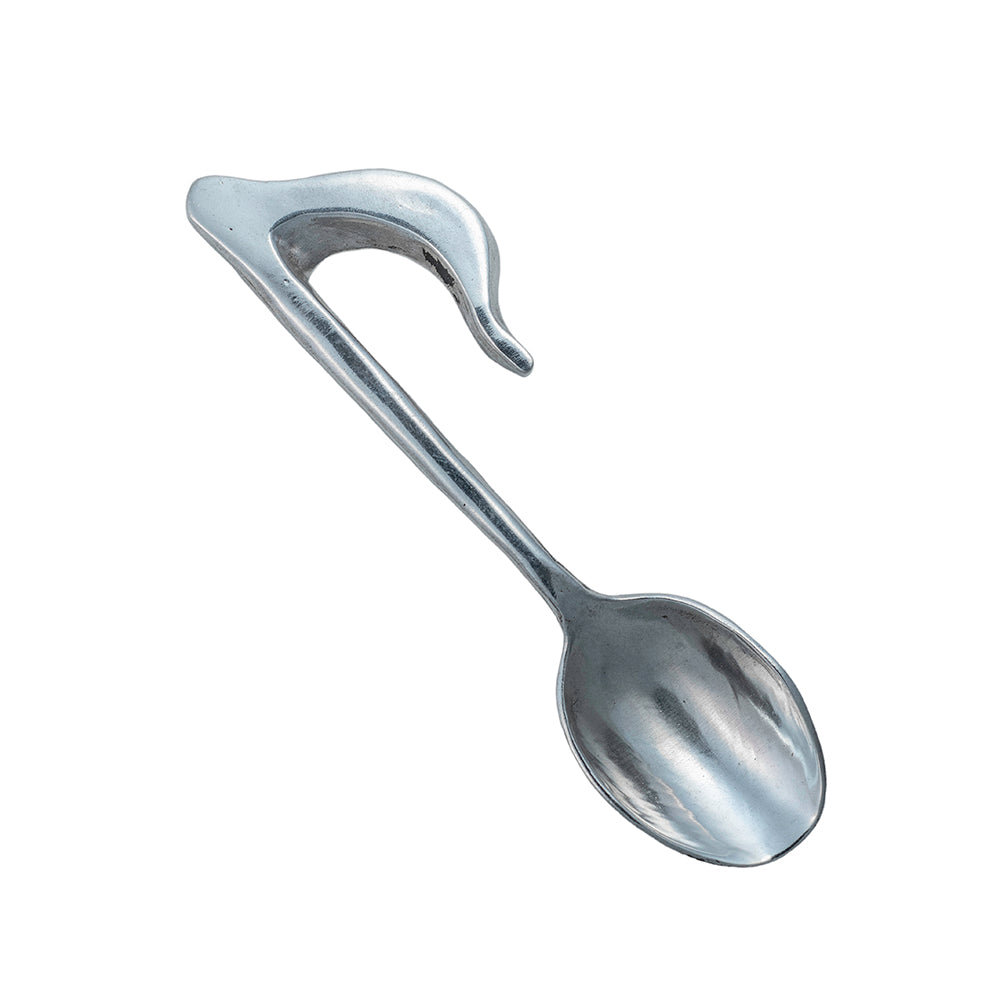 A silver spoon with the top of a music note for the handle.