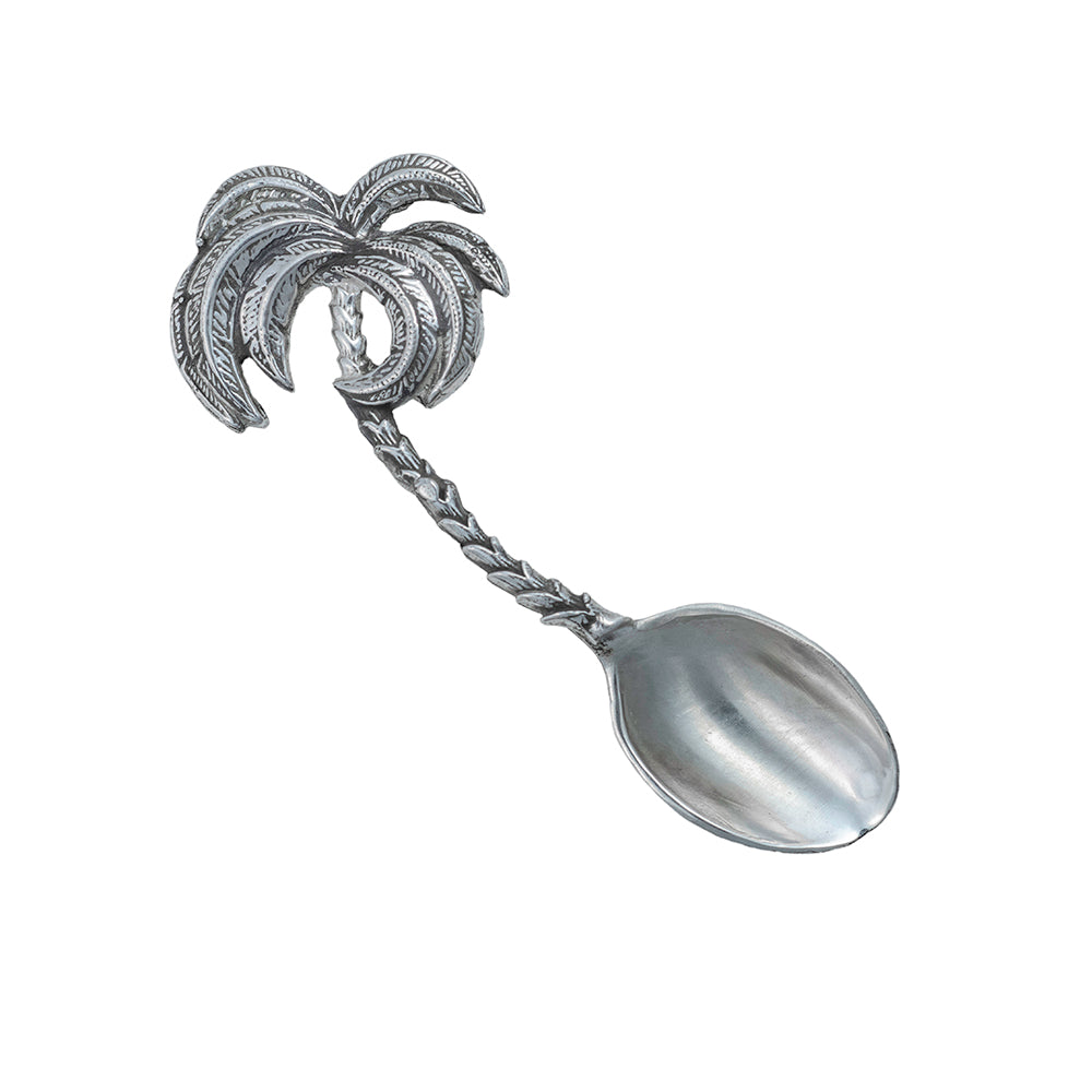Silver spoon with palm tree handle