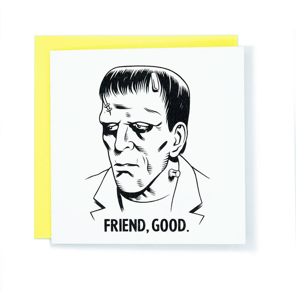 Square greeting card with black and white illustration of Frankenstein and words "Friend, Good" with bright yellow envelope.