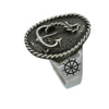 Silver ring with anchor and wheel design on a white background
