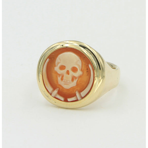 side view of gold ring with skeleton cameo