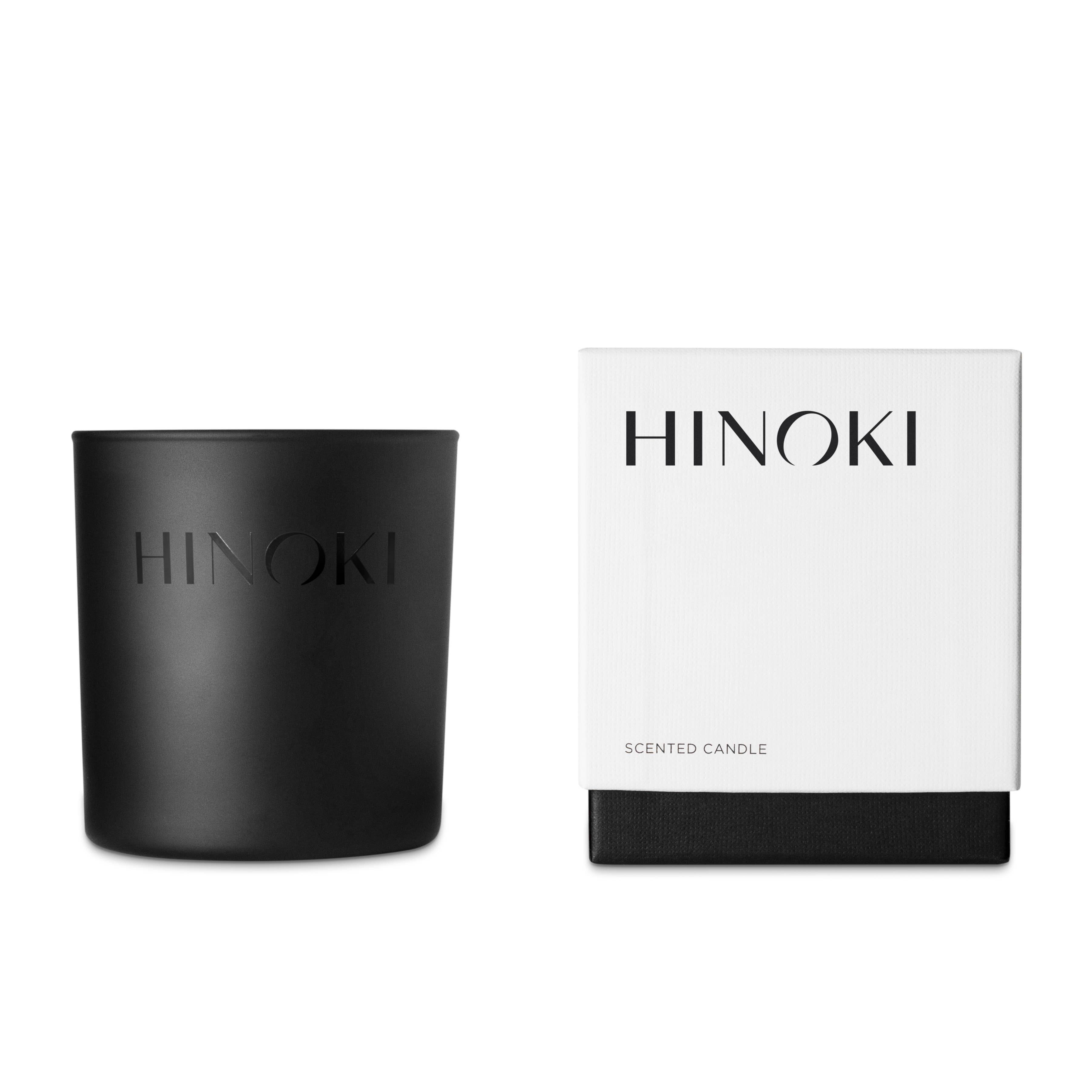 black glass candle and white box for candle that says hinoki