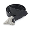 A silver megalodon shark tooth belt buckle with hand stamped black leather belt that is in a coil shape.