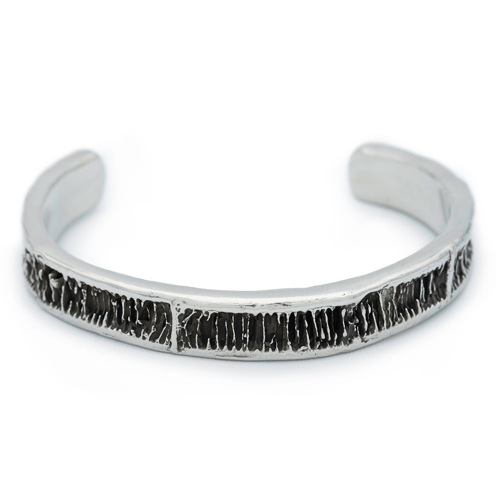 A half inch silver cuff with blackened detail from shark vertebrae.