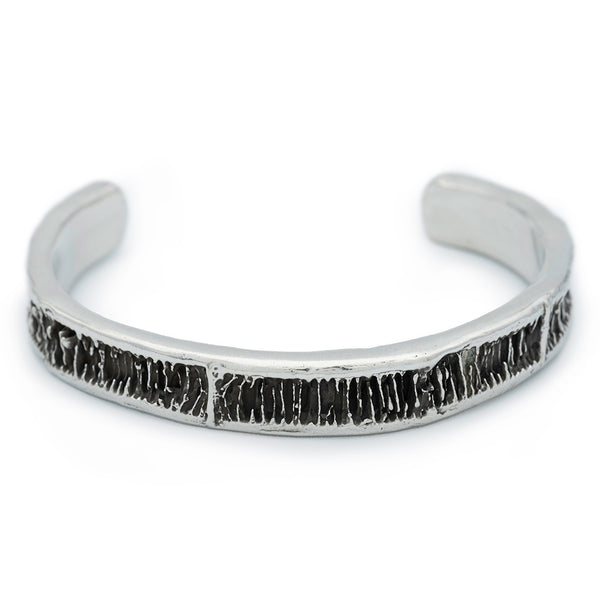 A half inch silver cuff with blackened detail from shark vertebrae.