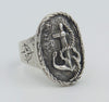 A silver ring with an anchor and rope detail on the front and engraved compass on the side.