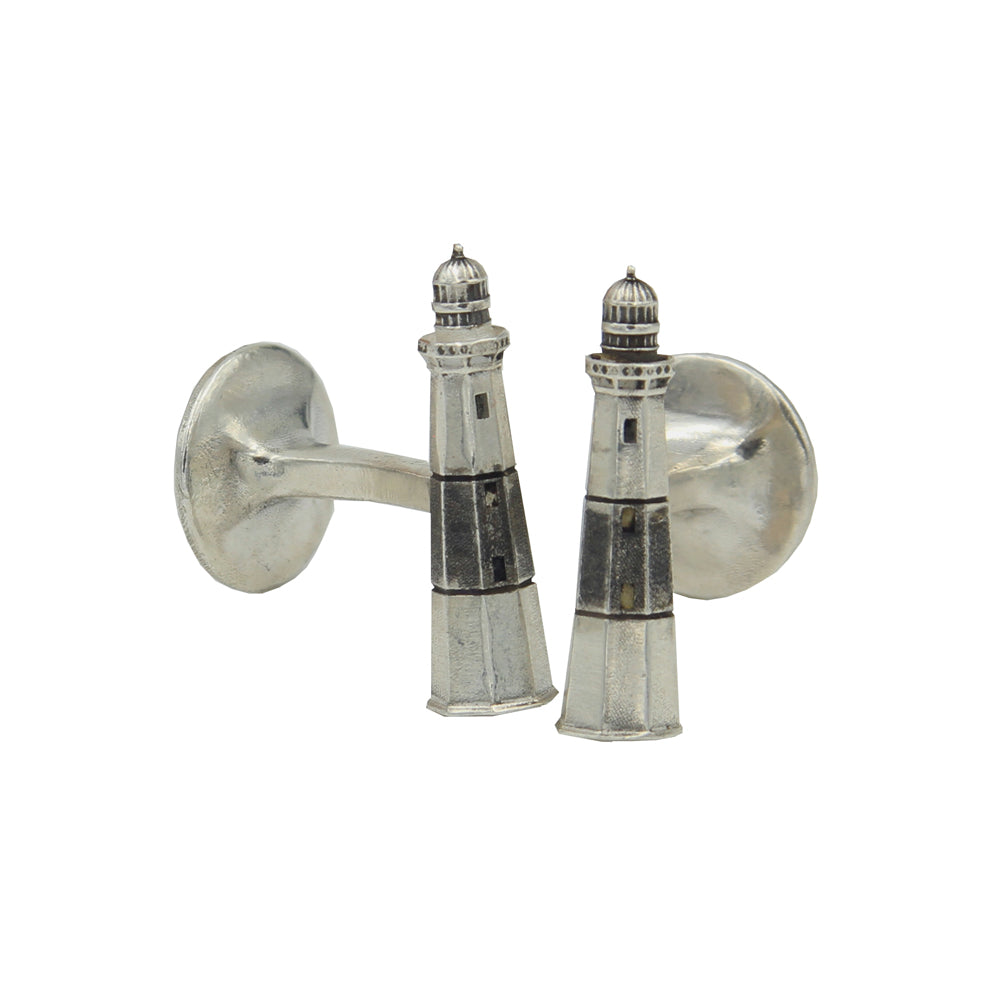 A pair of silver cufflinks with small lighthouse with antiqued black stripe.