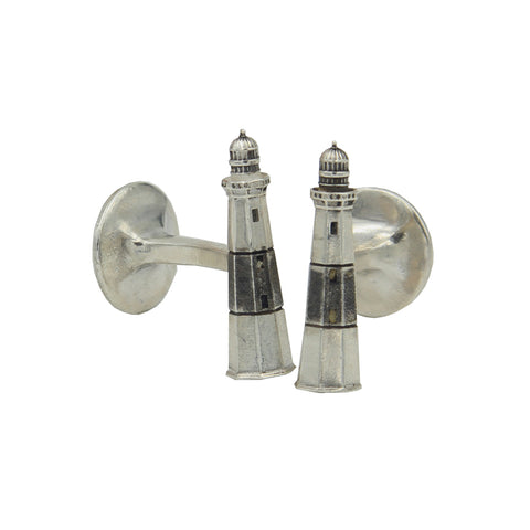 A pair of silver cufflinks with small lighthouse with antiqued black stripe.