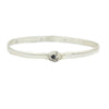 A round silver bangle style bracelet with a single barnacle  in silver.