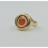 side view of gold ring holding cameo with carving of snake biting its tail