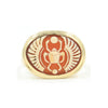 A gold ring set with cameo carved with a scarab.
