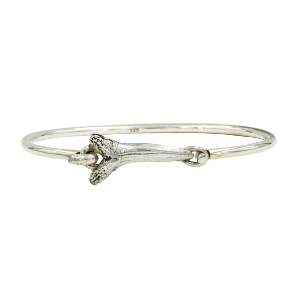 A Silver hook bracelet with a sharktooth center.