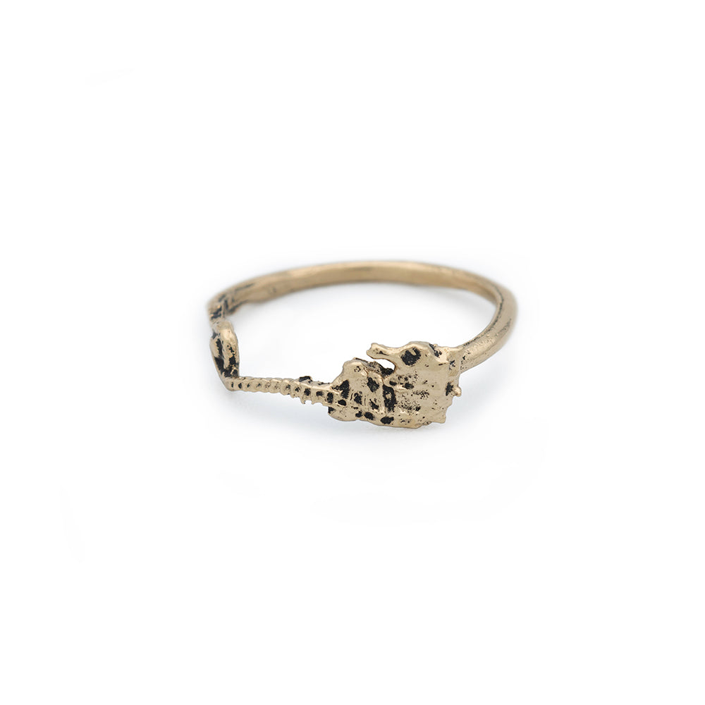 small gold band ring with seahorse